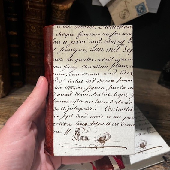 Blank notebook. Leather-bound back. ("Merci Louis") Blank notebook. Leather-bound back. ("Merci Louis")