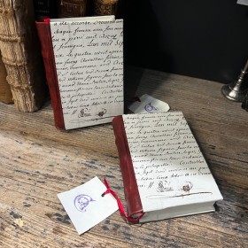 Blank notebook. Leather-bound back. ("Merci Louis")