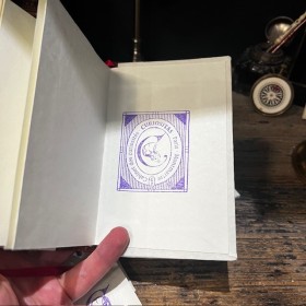 Blank notebook. Leather-bound back. ("Merci Louis")
