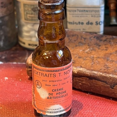 Extrait NOIROT - Crème Pêche artificielle - Flacon ancien de pharmacie