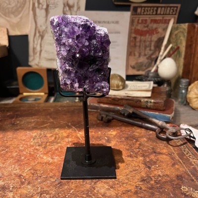 Amethyst fragment on a stand
