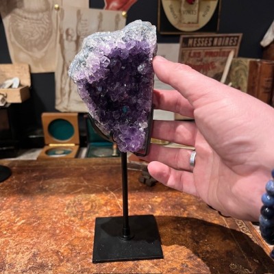 Amethyst fragment on a stand