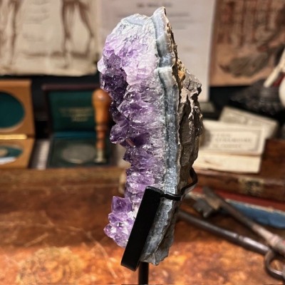 Amethyst fragment on a stand