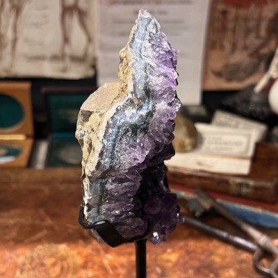 Amethyst fragment on a stand