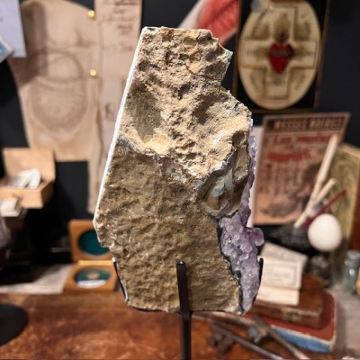 Amethyst fragment on a stand