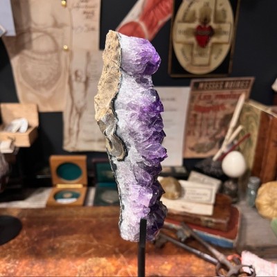 Amethyst fragment on a stand