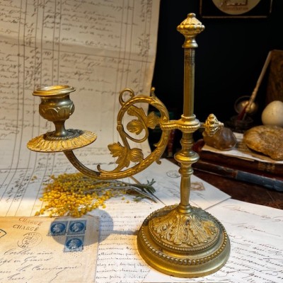 Antique brass candlestick or candle holder, adjustable height and swiveling