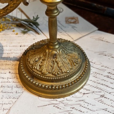 Antique brass candlestick or candle holder, adjustable height and swiveling