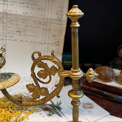 Antique brass candlestick or candle holder, adjustable height and swiveling