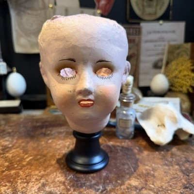 Antique papier-mâché doll’s head on a wooden base - Ref A