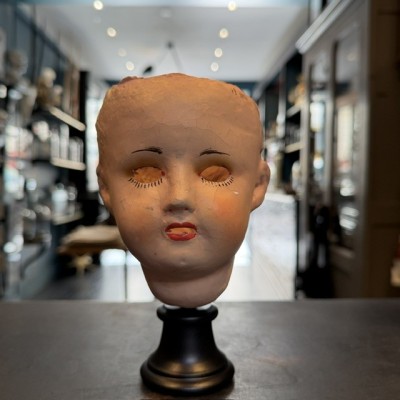 Antique papier-mâché doll’s head on a wooden base - Ref A