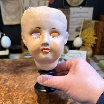 Antique papier-mâché doll’s head on a wooden base - Ref A