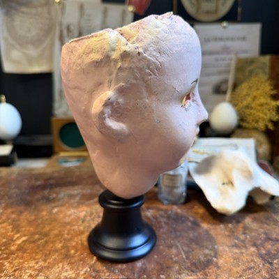 Antique papier-mâché doll’s head on a wooden base - Ref A