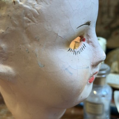 Antique papier-mâché doll’s head on a wooden base - Ref A