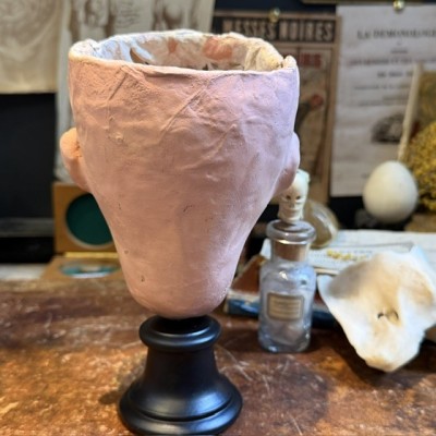 Antique papier-mâché doll’s head on a wooden base - Ref A