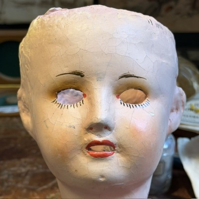 Antique papier-mâché doll’s head on a wooden base - Ref A