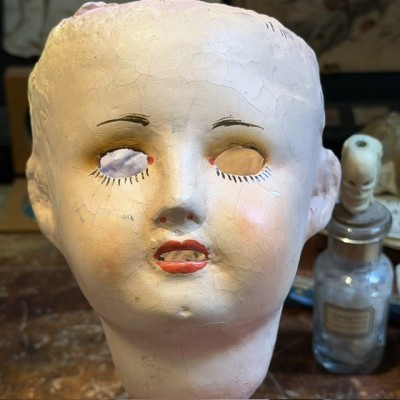 Antique papier-mâché doll’s head on a wooden base - Ref A