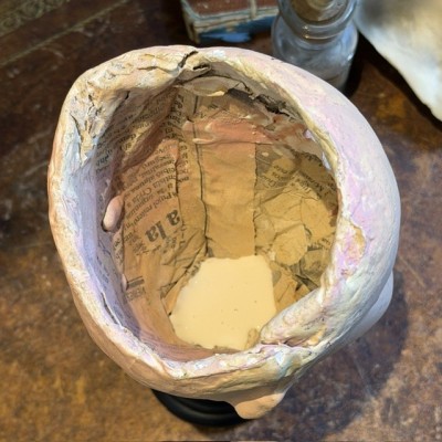 Antique papier-mâché doll’s head on a wooden base - Ref A