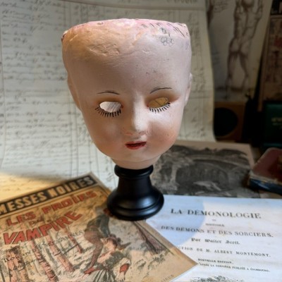Antique papier-mâché doll’s head on a wooden base - Ref A