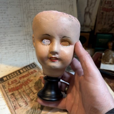 Antique papier-mâché doll’s head on a wooden base - Ref A