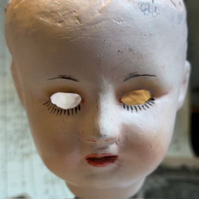 Antique papier-mâché doll’s head on a wooden base - Ref A