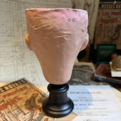 Antique papier-mâché doll’s head on a wooden base - Ref A