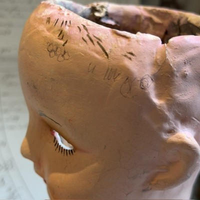 Antique papier-mâché doll’s head on a wooden base - Ref A