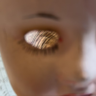 Antique papier-mâché doll’s head on a wooden base - Ref A