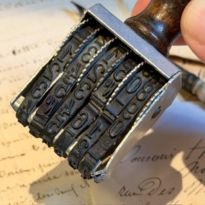 Antique mechanical date stamp with rotating discs - Weathered wooden handle
