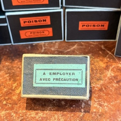 To be used with care - Antique labels in a pharmacy box for remedy in canvas cardboard