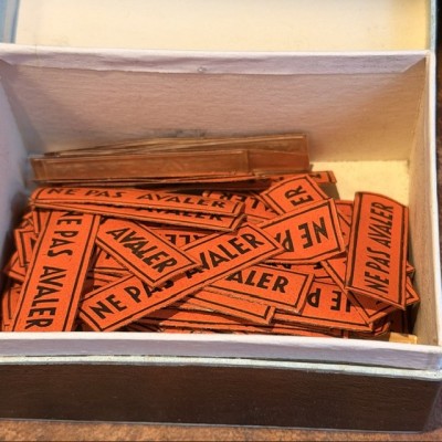 Do not swallow - Antique labels in a pharmacy box for remedy in canvas cardboard