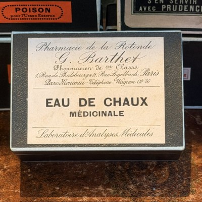 Eau de Chaux Médicinale - Antique labels in a pharmacy box for remedy in canvas cardboard